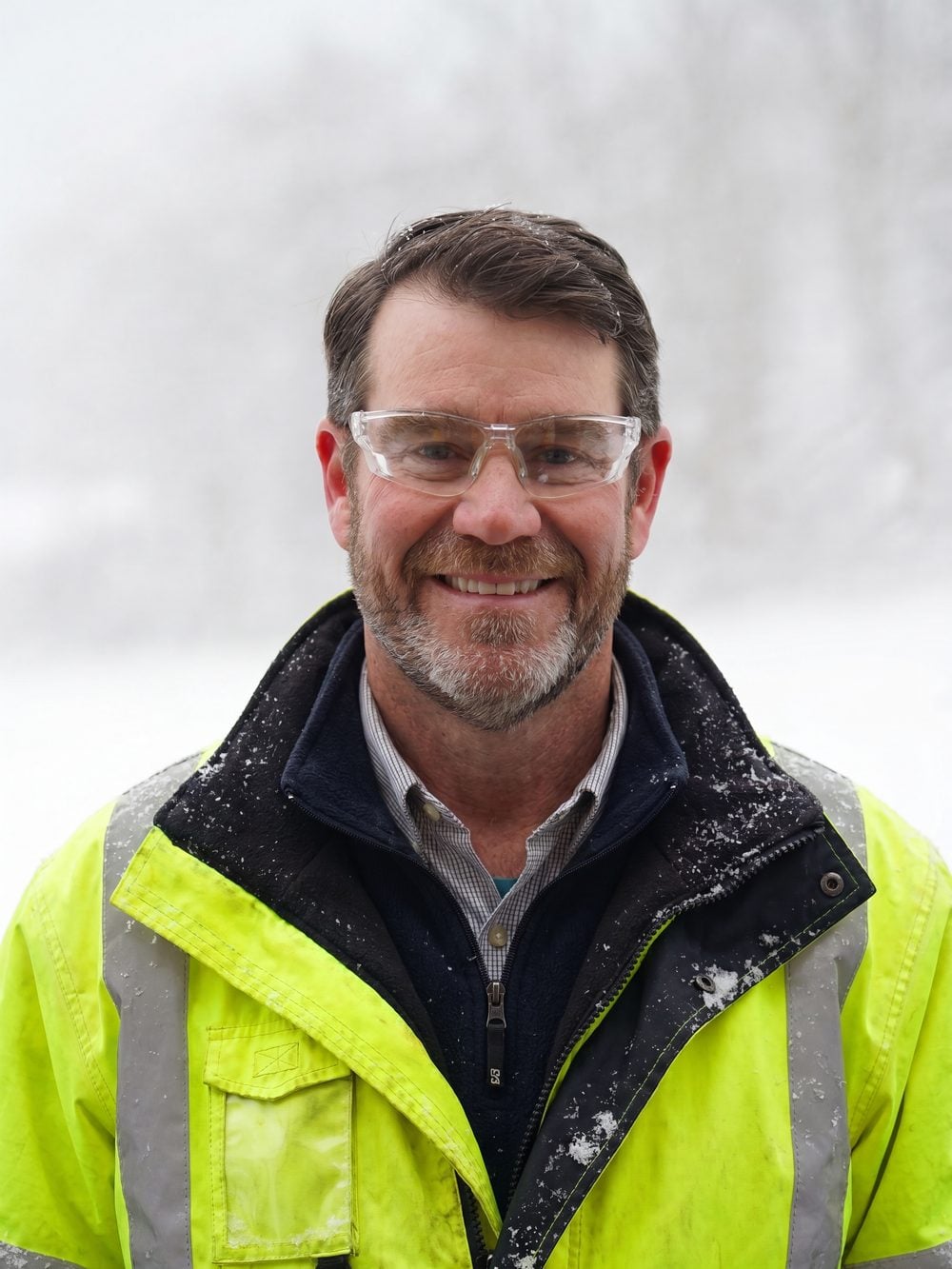Bill Spicer, owner of Sparkle Lake Services, standing in front of his truck on a job in New London County